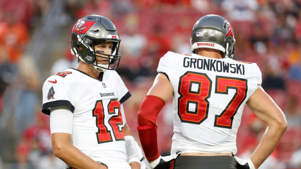 Aug 14, 2021; Tampa, Florida, USA; Tampa Bay Buccaneers quarterback Tom Brady (12) and tight end Rob Gronkowski (87) looks on against the Cincinnati Bengals during the first quarter at Raymond James Stadium. Mandatory Credit: Kim Klement-USA TODAY Sports